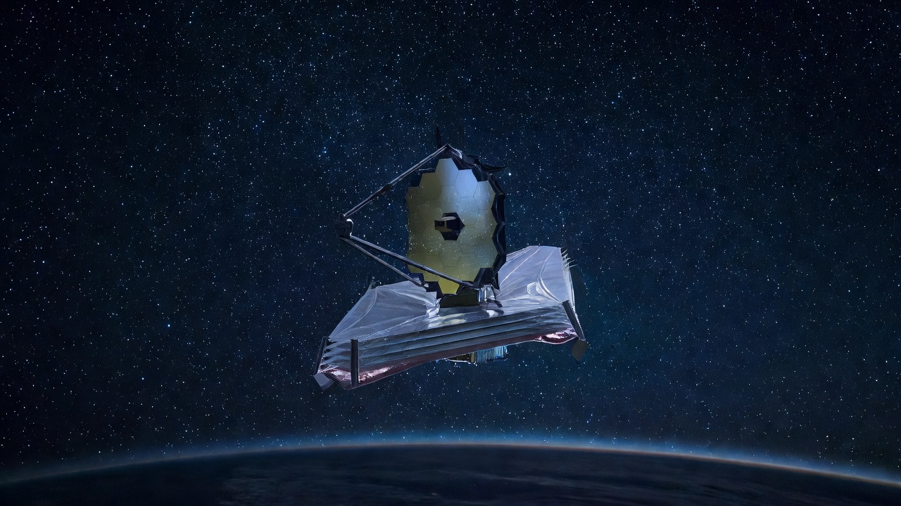 Wide-angle deep-field photograph of the James Webb Space Telescope drifting above Earth's dark limb, sunshield fully deployed, cold blue starfield stretching to infinity, shot at orbital distance with a long telephoto lens under glacial ambient starlight.